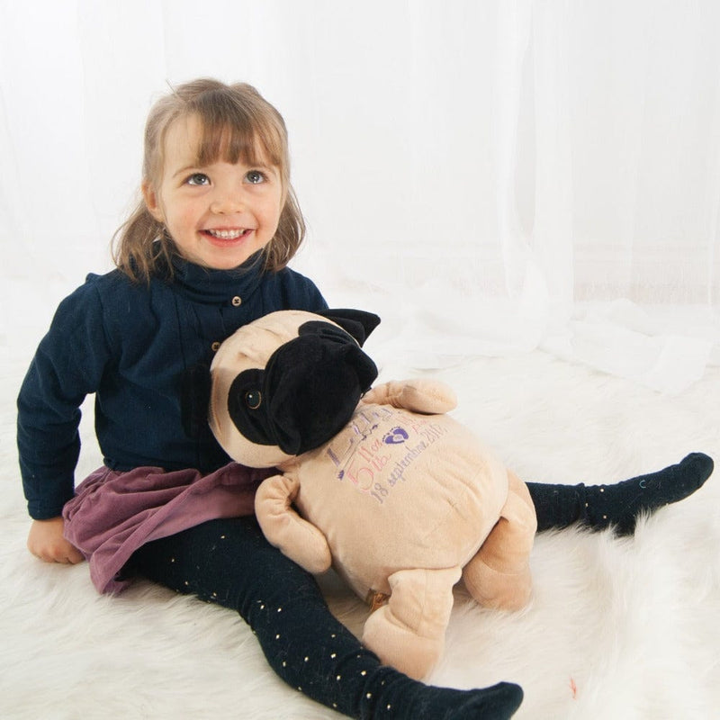 A girl with her personalized stuffed pug